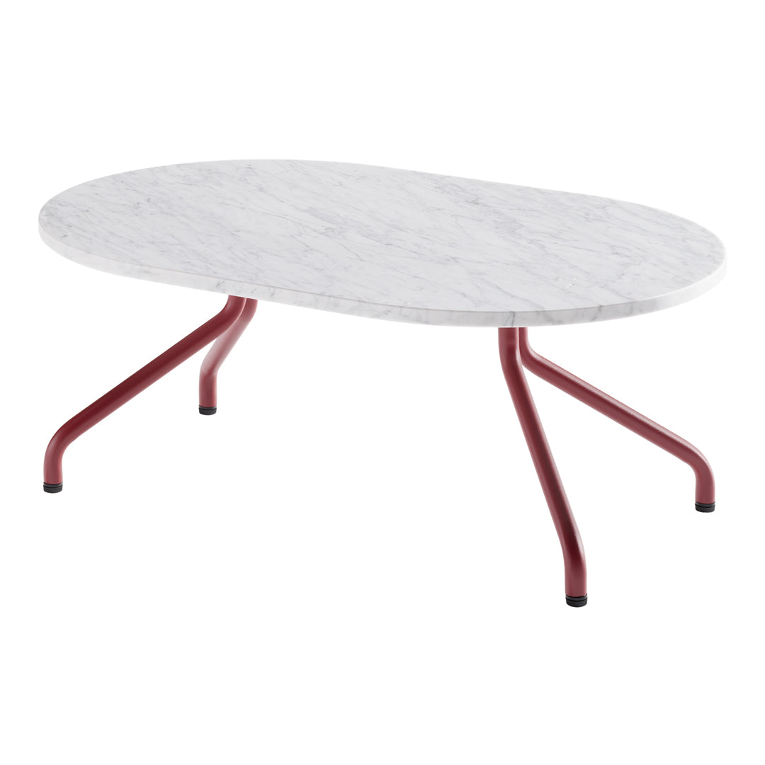 Oval coffee table with a white marble top and red metal legs, featuring a modern and minimalistic design.
