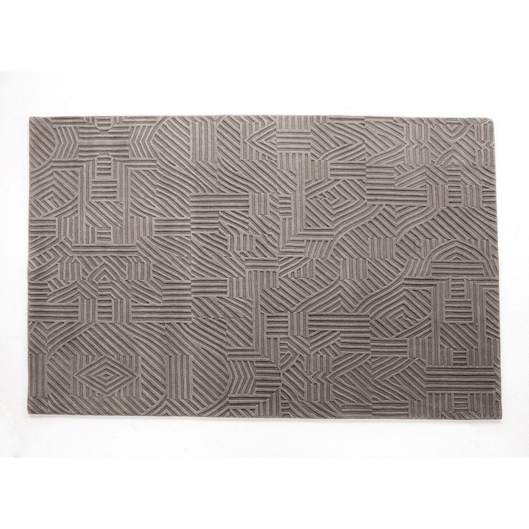 Gray geometric patterned rug with intricate line designs. Stylish and modern home decor accent.