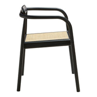 Black chair with a sleek design, featuring a natural caned seat and curved armrests for a modern touch.