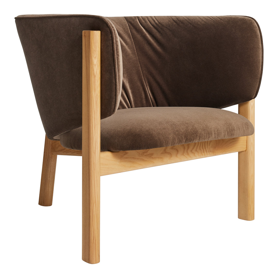 Cozy brown velvet chair with a smooth texture and minimalist wooden legs, perfect for modern interiors.