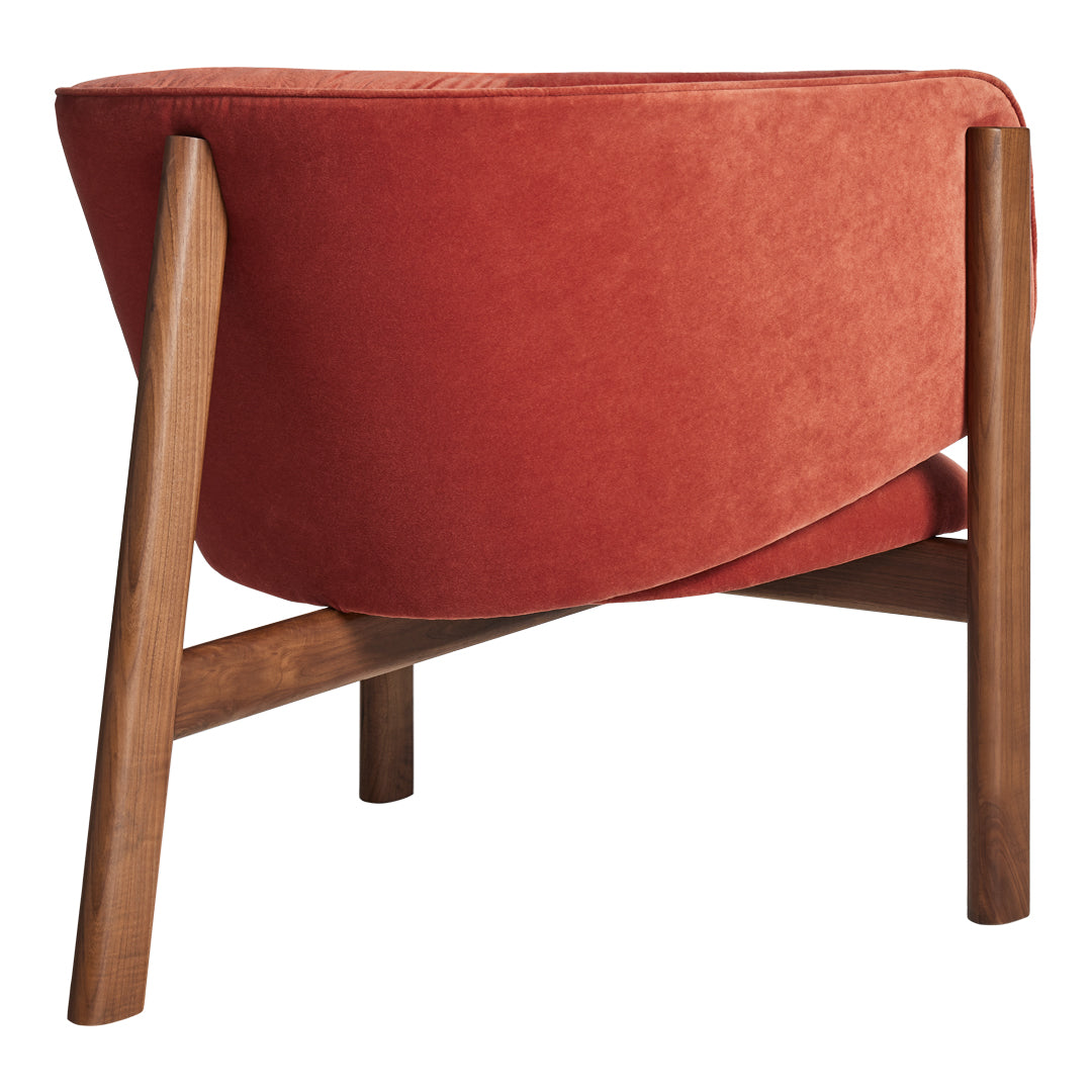 Rust orange fabric chair with smooth contours and natural wood legs, perfect for modern decor.