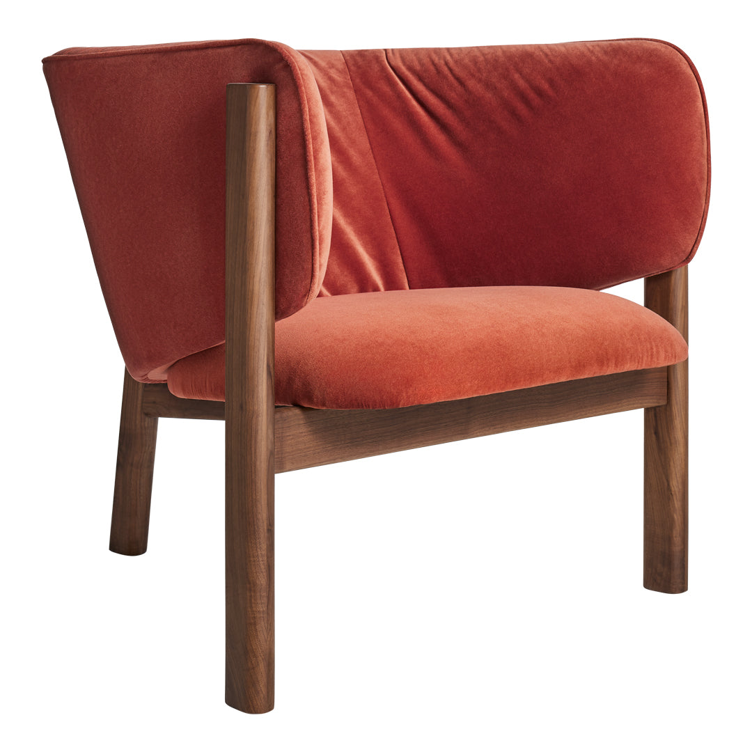 Soft velvet chair in warm orange tones with a smooth, minimalist design and wooden legs. Perfect for modern decor.