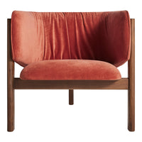 Velvet armchair in coral orange with a smooth, plush finish and minimalist wood frame. Ideal for modern decor.