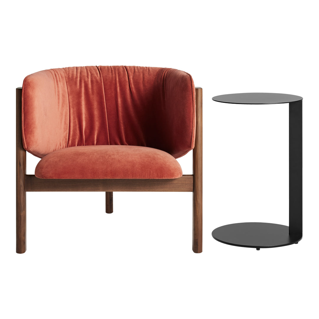 Velvet orange accent chair with wooden frame and sleek black side table. Elegant modern design with rich color contrast.