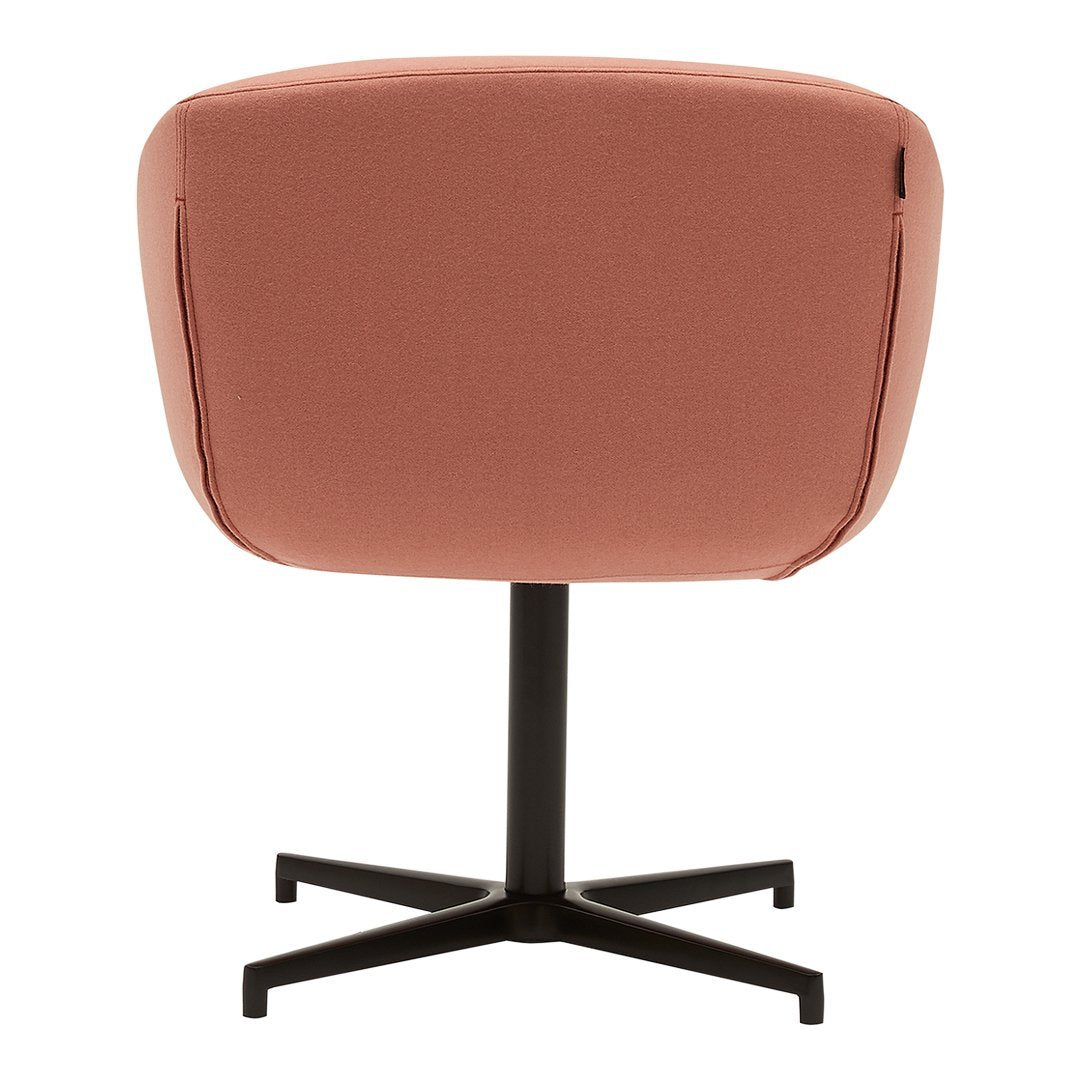 Stylish pink upholstered chair with a sleek black metal base and minimalist design. Perfect for modern decor.