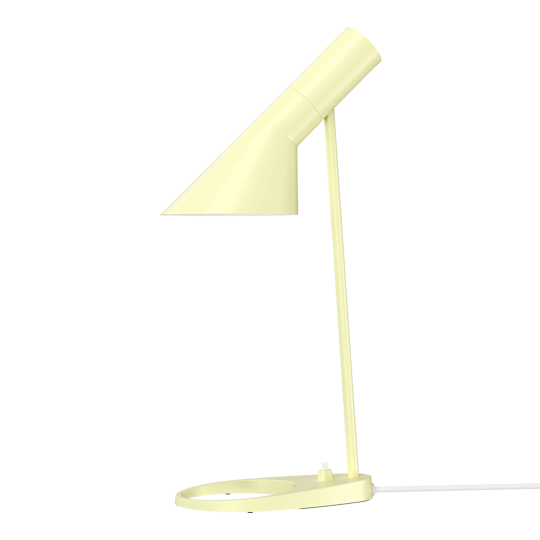 Stylish yellow desk lamp with a sleek geometric design and a smooth matte finish. Perfect for modern interiors.