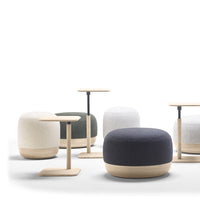 Set of poufs and side tables featuring neutral tones, textured fabrics, and a modern minimalist design.