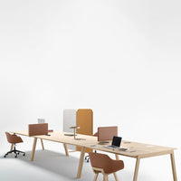 Minimalist office setup featuring warm wood tones and soft, muted colors in a contemporary design.