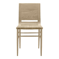 Light oak chair with a minimalist design and smooth wooden texture, showcasing natural wood grain patterns.