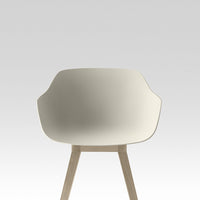 Minimalist cream chair with smooth, curved design and light wooden legs against a soft gray background.