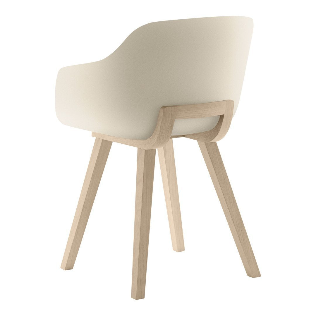 Light beige armchair with a smooth, minimalist design and natural wood legs. Perfect for modern decor.