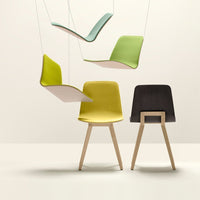 Colorful modern chairs in vibrant green, soft mint, and sleek black with seamless, smooth patterns. Stylish design elements.