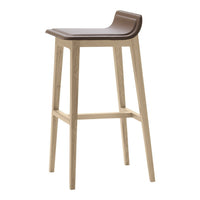 Brown leather stool seat with a smooth finish, complemented by natural light wood legs in a simple, modern design.
