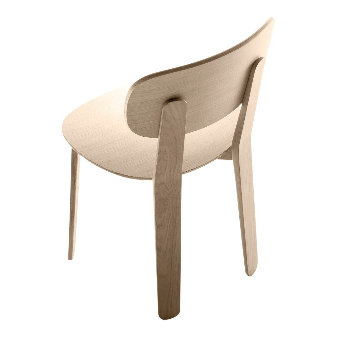 Light beige wooden chair with a smooth, minimalist design and natural wood finish. Elegant and modern aesthetic.