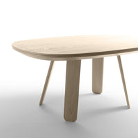 Light wood oval table with smooth surface and four tapered legs, showcasing a natural finish and minimalist design.