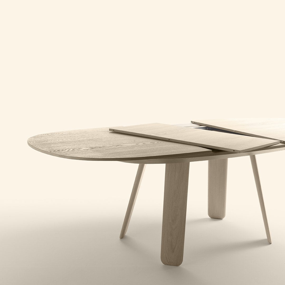 Natural wood grain oval table with light beige finish and sleek, minimalistic design. Perfect for modern decor.