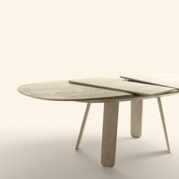 Natural wood grain oval table with light beige finish and sleek, minimalistic design. Perfect for modern decor.
