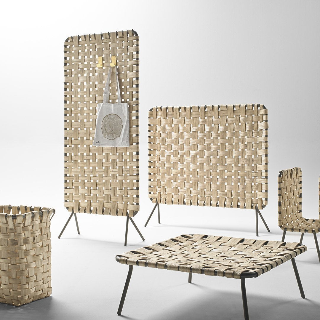 Natural woven textures in beige with geometric patterns; stylish and modern home decor items.