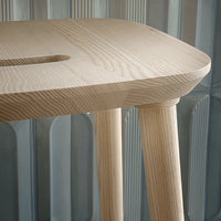 Light ash wood table with a smooth, natural finish and simple, clean lines. Minimalist design complements any decor.