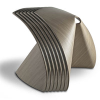 Sleek, modern metallic sculpture with brushed silver finish and graceful curved lines. Perfect for contemporary decor.