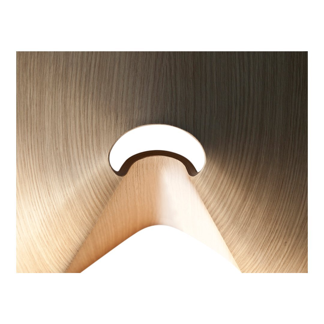 Beige wood texture with smooth curves and a subtle circular cutout, creating a modern, minimalist look.