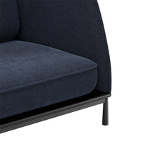 Deep navy upholstery with a subtle textured pattern, set on a sleek black metal frame.