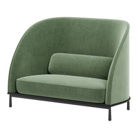 Green velvet loveseat with curved shape and black metal legs, featuring a smooth, modern texture and minimalist design.