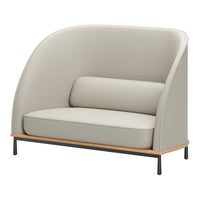 Modern beige couch with a curved design and matching lumbar pillow, featuring sleek black legs and a wooden base.