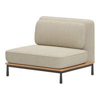 Beige upholstered lounge chair with a smooth texture, complemented by a natural wood and black metal frame.