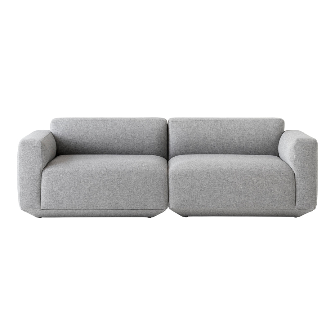 Gray modern sofa with a minimalist design and soft, textured upholstery.