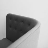 Gray upholstered chair with button-tufted detailing and a smooth, minimalist design. Ideal for modern decor.