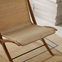 Natural beige seat with subtle tan stripes, complemented by a light wood frame, perfect for modern decor.