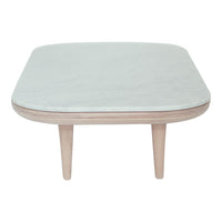 Light grey marble top coffee table with rounded edges and natural wood legs. Modern, minimalist design.