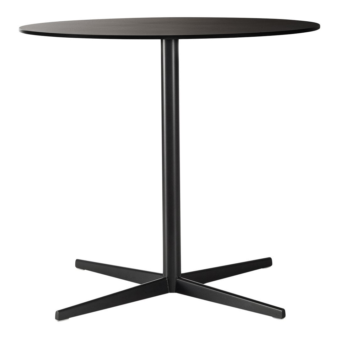 Round black table with a smooth surface and sleek black metal base design, perfect for modern decor.
