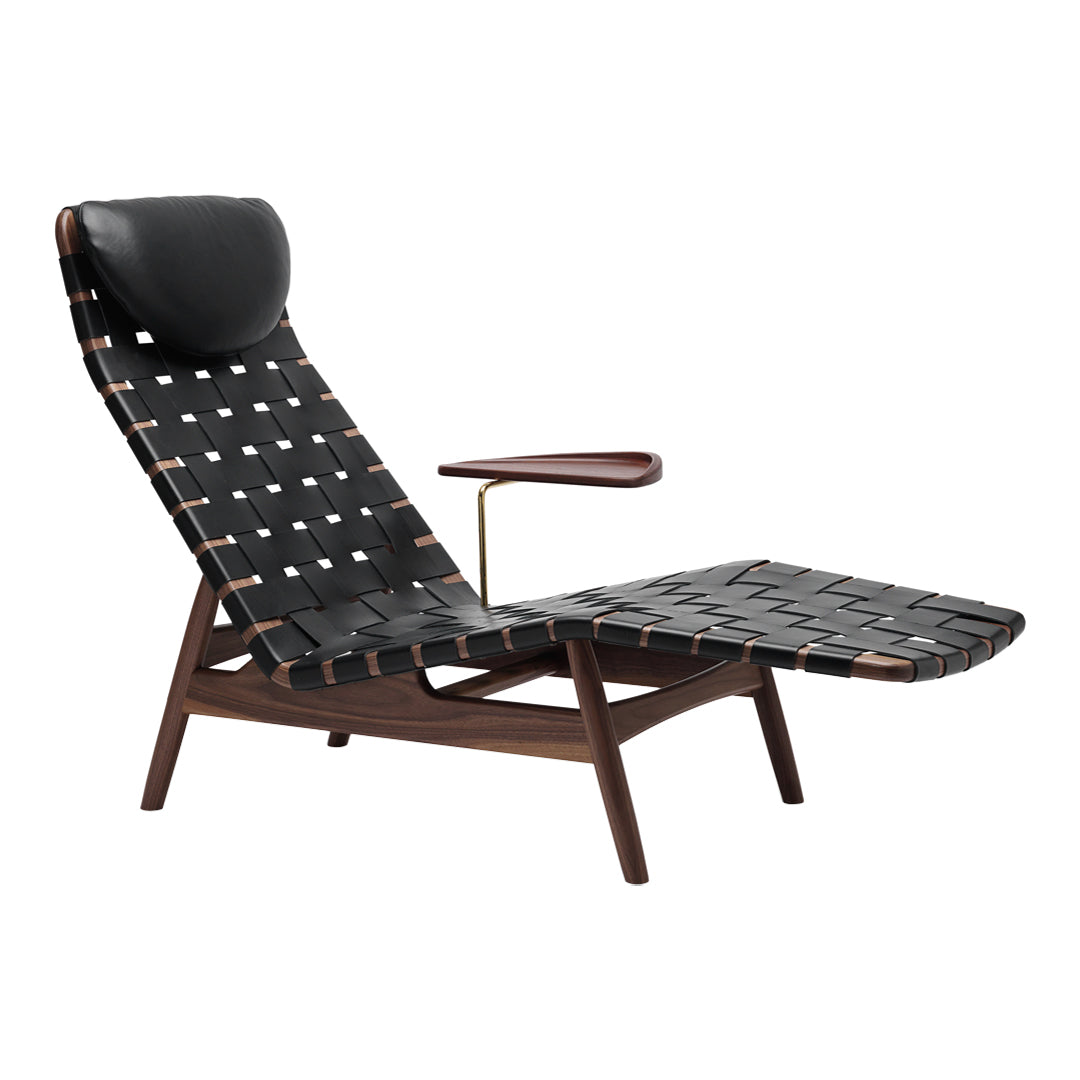 Black woven fabric with white squares, accented by dark wood and a sleek leather headrest. Modern lounge chair design.