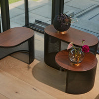 Set of three contemporary side tables featuring wooden and black mesh patterns, perfect for modern decor.