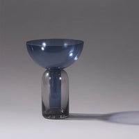 Modern blue and grey glass vase with a smooth, minimalist design and a unique bowl-shaped top.