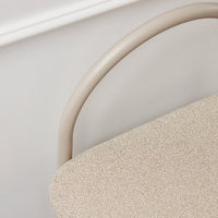 Beige textured fabric with a soft, neutral-tone metal frame and smooth curves. Ideal for modern decor.