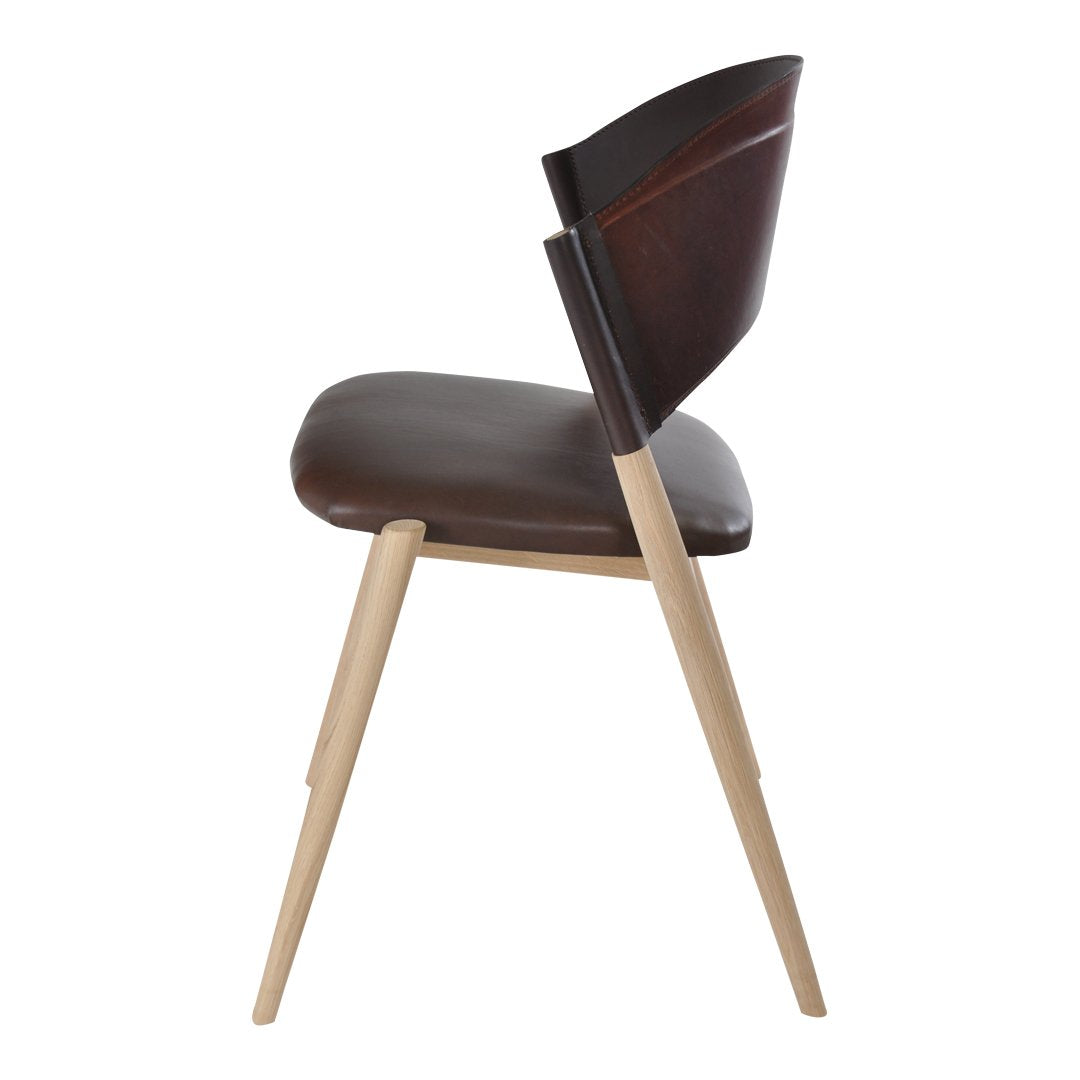 Side view of a modern chair featuring a brown leather seat and natural wood legs, with smooth, minimalist design.