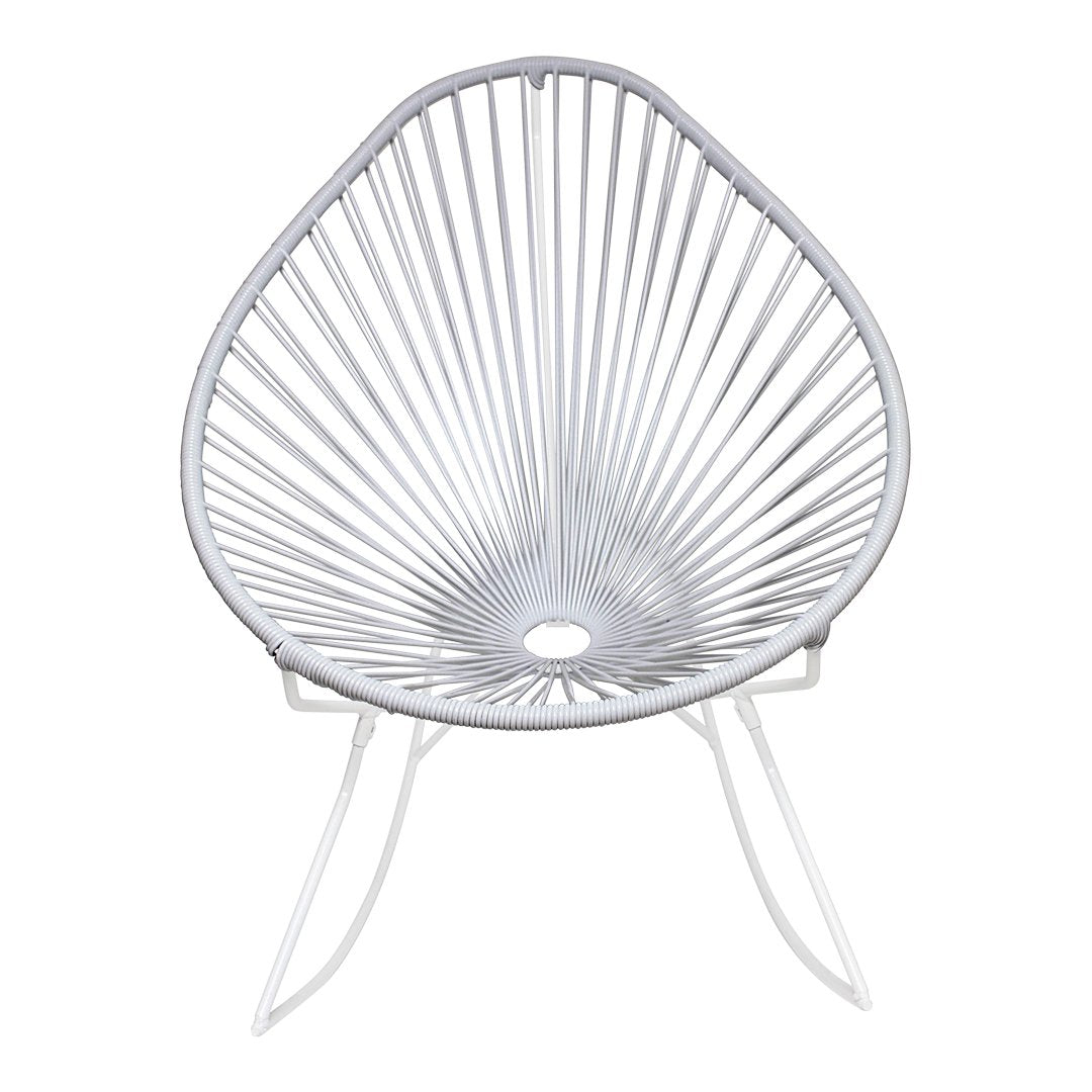 White Acapulco chair featuring a unique fan-like pattern and sleek, minimalist design for contemporary decor.