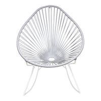 White Acapulco chair featuring a unique fan-like pattern and sleek, minimalist design for contemporary decor.