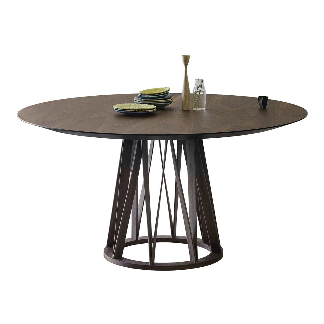 Round wooden dining table with a dark walnut finish and a geometric base featuring a natural wood tone and sleek lines.
