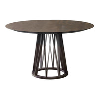 Round dark wood dining table with a sleek geometric base in a rich brown finish, showcasing modern design aesthetics.