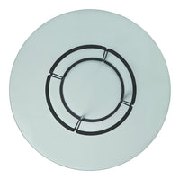 Round glass tabletop with a smooth, pale blue surface and black circular metal accents creating a modern design.