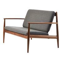 Gray linen upholstery with a wood frame, featuring clean lines and a modern, minimalist design.