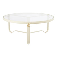 Circular coffee table with a glass top and cream-colored metal frame, featuring sleek, modern lines.