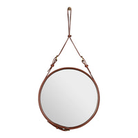 Round mirror with a sleek silver surface and a warm brown leather strap for modern decor.