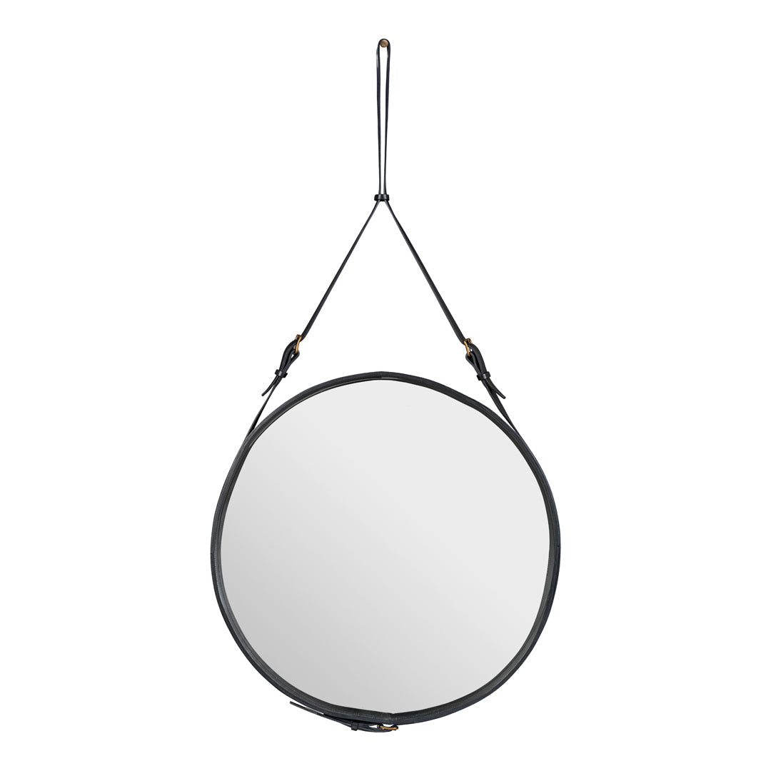 Round mirror with a sleek black leather frame and minimalist hanging strap, perfect for modern decor.