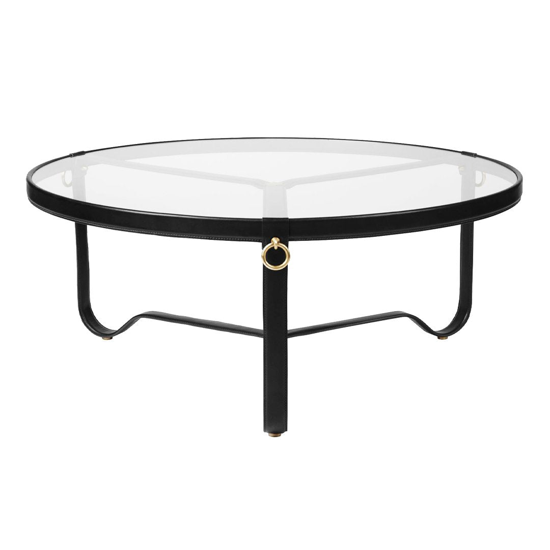 Stylish round coffee table with a sleek black metal frame and clear glass top, featuring elegant gold accents.