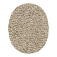Soft beige oval rug with a fluffy texture, ideal for cozy decor. Perfect for indoor spaces.